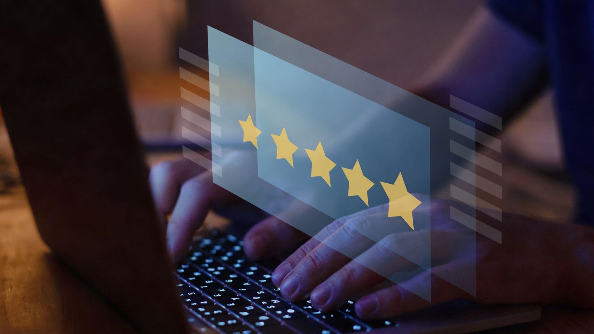 image showing a hand typing on keyboard with 5 star rating on screen