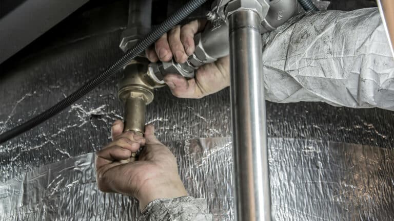 Image of a plumber working in New York